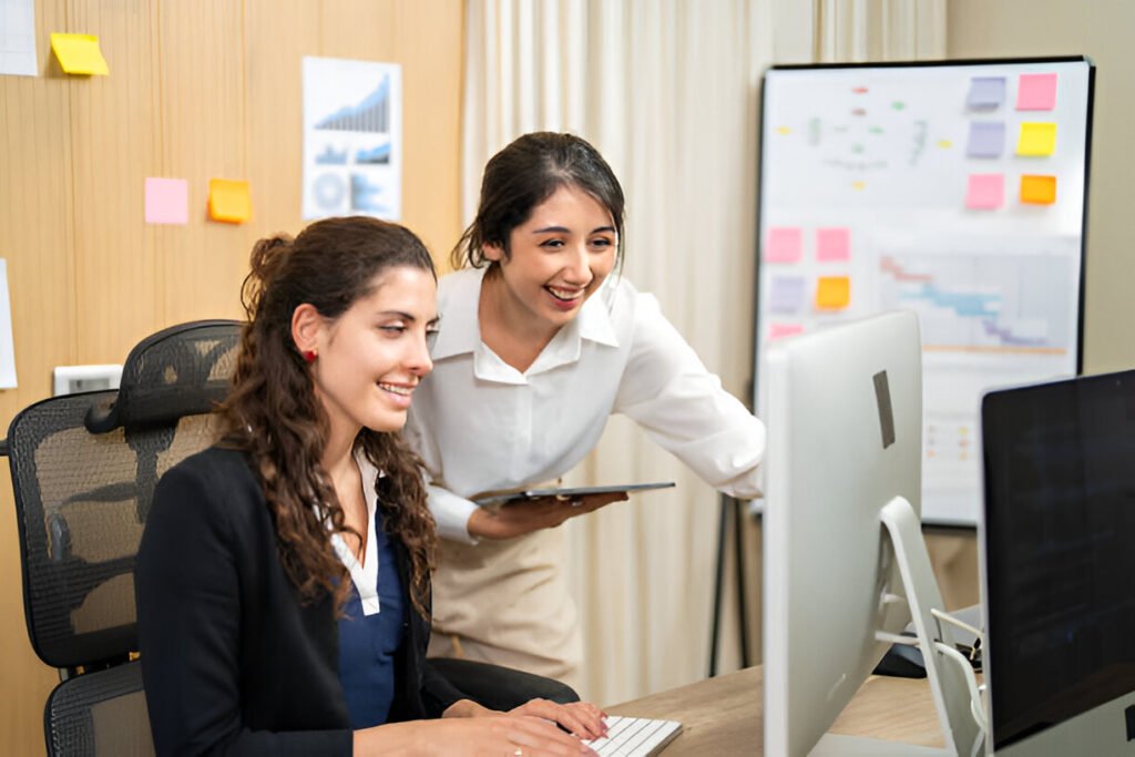 Collaborative Female Programmers Working on a business Software Development Project in Office